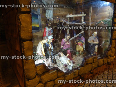 Stock image of Christmas nativity scene with religious statues / figures, baby Jesus