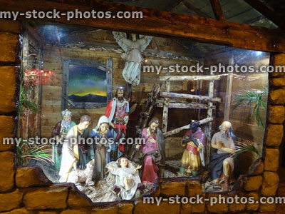 Stock image of religious statues in nativity scene at Christmas, baby Jesus