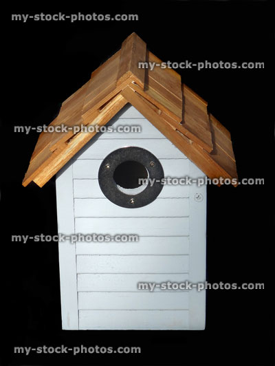 Stock image of wooden painted blue beach hut nestbox / bird nesting box