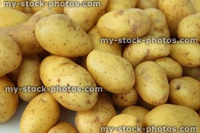 Stock image of new potatoes, washed and ready for potato salad