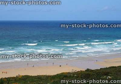 Stock image of Newquay, Cornwall beach surfing school lessons on sand