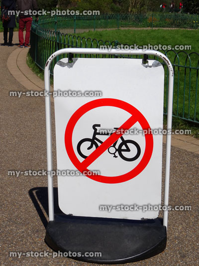 Stock image of no cycling sign on park pathway / pavement