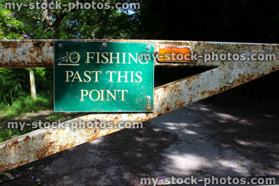 Stock image of green sign on gate saying 'No fishing past this point'