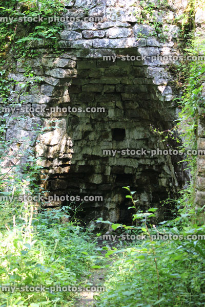 Stock image of old stone lime kiln in woodland, quicklime calcination