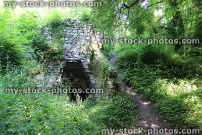 Stock image of old stone lime kiln in woodland, quicklime calcination
