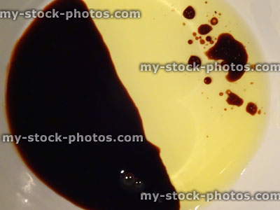 Stock image of balsamic vinegar and olive oil mixed together in dish