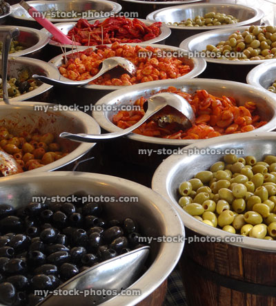 Stock image of dishes of stuffed olives / Mediterranean food at market