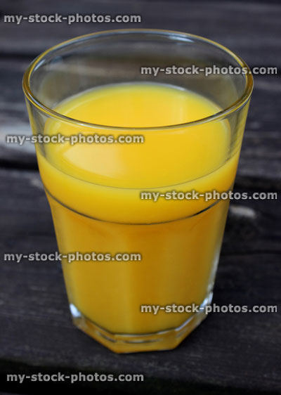 Stock image of glass of orange juice served as breakfast drink