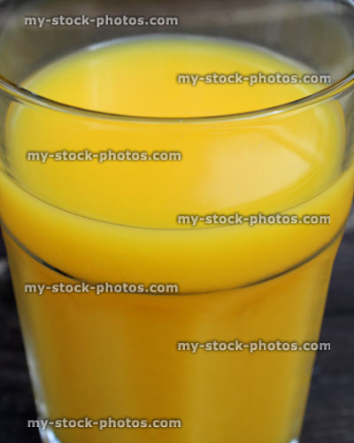 Stock image of glass of orange juice served as breakfast drink