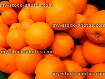 Stock image of fresh, ripe, unwaxed oranges at supermarket, fruit shop