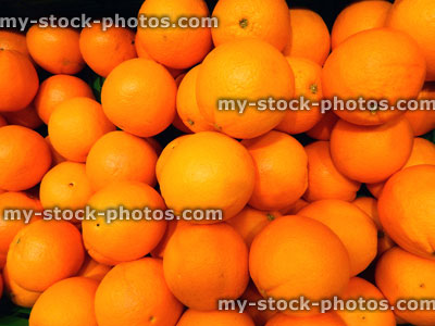 Stock image of fresh, ripe, unwaxed oranges at supermarket, fruit shop
