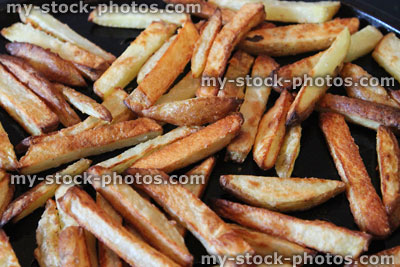 Stock image of healthy homemade oven chips / French fries / potato wedges