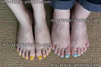 Stock image of feet, toenails painted with nail varnish, blue / yellow