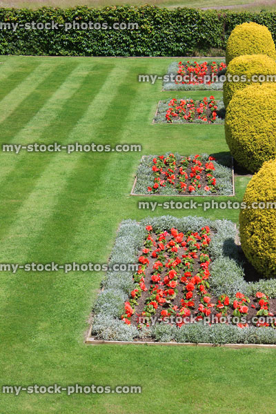 Stock image of beautiful grass lawn with stripes, annual flower beds