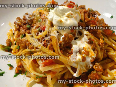 Stock image of pappardelle / tagliatelle pasta ribbons, tomato ragu sauce, bolognese mince meat