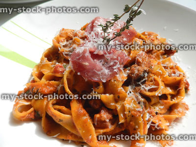 Stock image of tagliatelle pasta with crispy pancetta ham, parmesan cheese