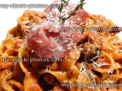 Stock image of tagliatelle pasta with crispy pancetta ham, parmesan cheese