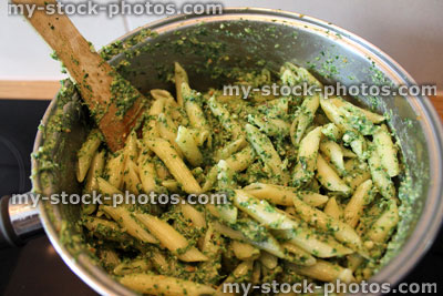 Stock image of freshly made pesto pasta, cooked / mixed in saucepan