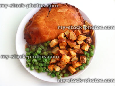 Stock image of Cornish pasty with cubed potatoes and peas (close up)