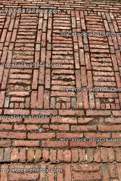 Stock image of red brick path, block paving, paved pathway, stack bond pattern
