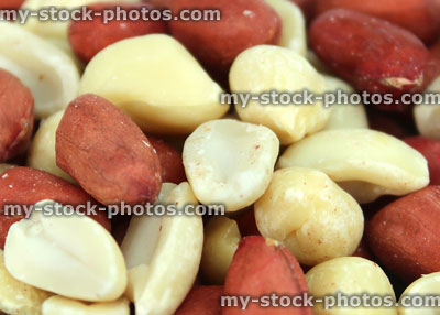Stock image of mixed red skin peanuts close up with skins, healthy snackfood