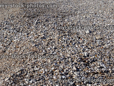 Stock image of water-worn pebbles on a shingle beach, attrition erosion