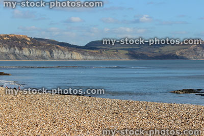 Stock image of Lyme Regis beach with background of sea / cliffs