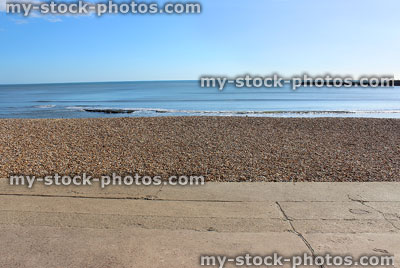 Stock image of seaside promenade, shingle beach, sand, sea and sky