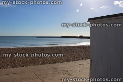 Stock image of beach hut in Lyme Regis, beachfront, sea, sky