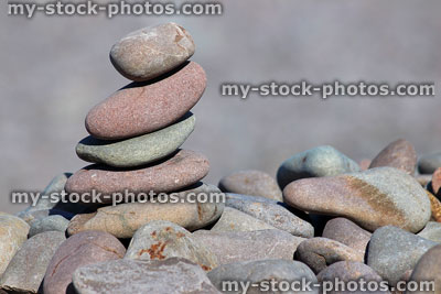 Stock image of balancing pebble tower on beach, stack of stones