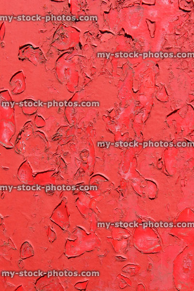 Stock image of red flaky paint, flaking metal paint, rusty, weathered