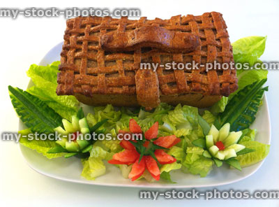 Stock image of picnic basket pie with flowers carved from vegetables
