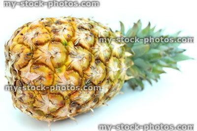 Stock image of fresh organic pineapple fruit, isolated on white background