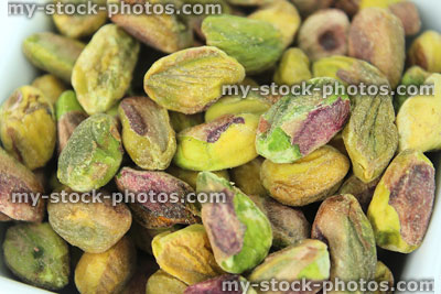 Stock image of shelled pistachio seeds / nuts close up, protein and antioxidants
