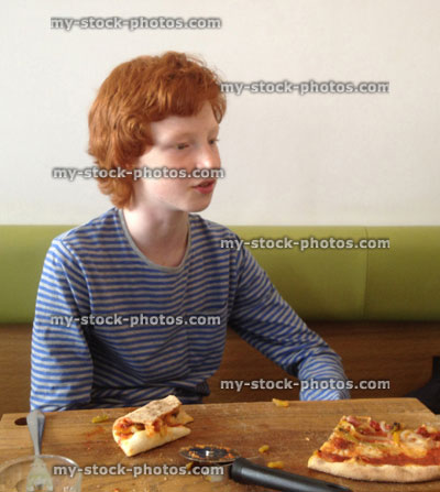 Stock image of boy in a pizza restaurant