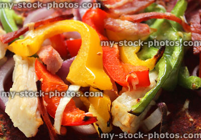 Stock image of healthy pizza, wholemeal dough, chopped mixed peppers, chicken, red onions
