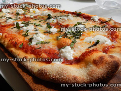 Stock image of homemade cheese and tomato margherita pizza, Italian restaurant, pizza crust