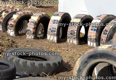 Stock image of children's playground with tunnel made from tractor tyres