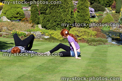 Stock image of happy children playing on garden lawn in sunshine