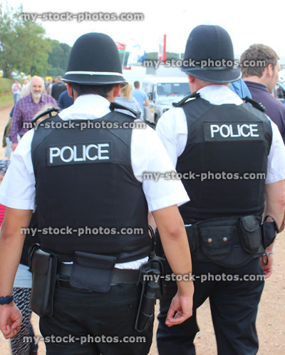 Stock image of policemen with helmets, patrolling Frome Cheese Show crowds
