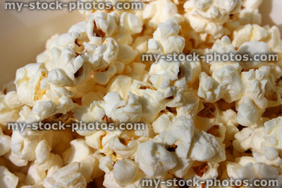 Stock image of salted popcorn, freshly popped corn, butter, toffee (close up)