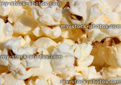 Stock image of salted popcorn, freshly popped corn, butter, toffee (close up)