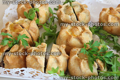 Stock image of homemade pork pies, buffet party food, pastry, plate
