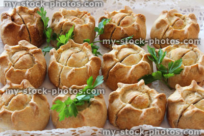 Stock image of homemade pork pies, buffet party food, pastry, plate