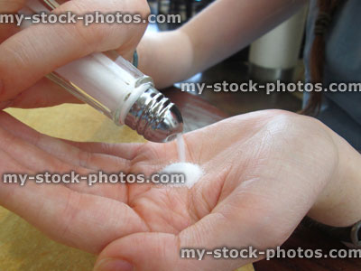 Stock image of salt being poured into hand / palm, pouring salt
