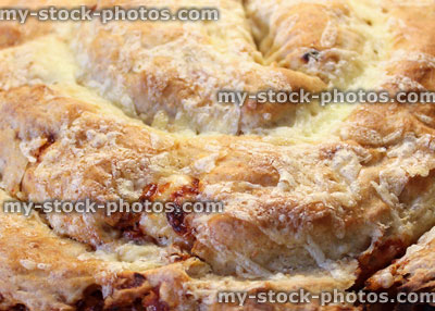 Stock image of homemade savoury povitica bread, coiled pizza bread with cheese topping