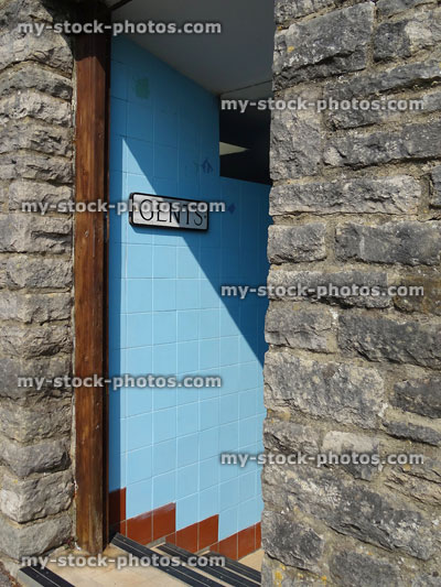 Stock image of entrance to gents public toilets, painted blue tiles