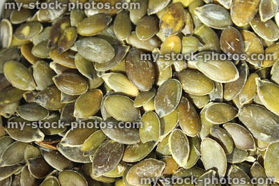 Stock image of pumpkin seeds / nuts, high protein healthy snack food, health benefits