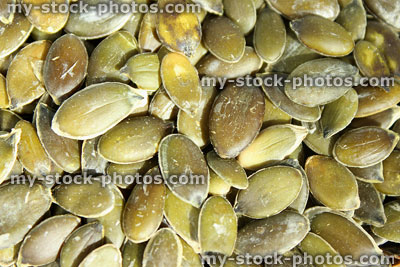 Stock image of pumpkin seeds / nuts, high protein healthy snack food with health benefits