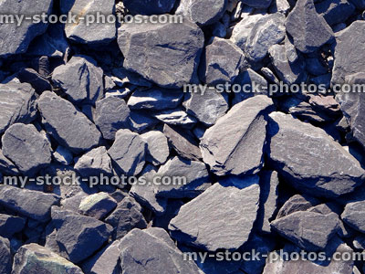 Stock image of purple slate mulch, close up of paddlestones in sunshine